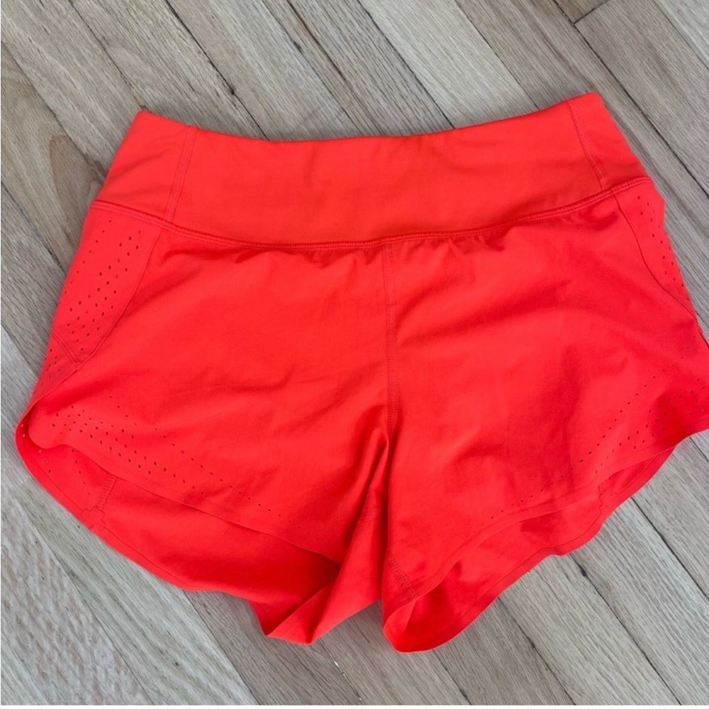 Red orange Athleta running shorts